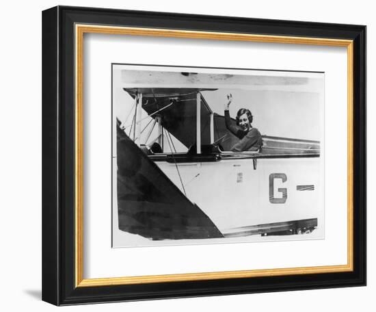 Amy Johnson (Mrs Mollison) Sits in Her Plane and Smiles and Waves to the Camera-null-Framed Art Print