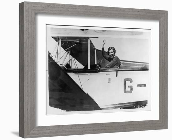 Amy Johnson (Mrs Mollison) Sits in Her Plane and Smiles and Waves to the Camera-null-Framed Art Print