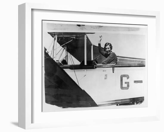 Amy Johnson (Mrs Mollison) Sits in Her Plane and Smiles and Waves to the Camera-null-Framed Art Print