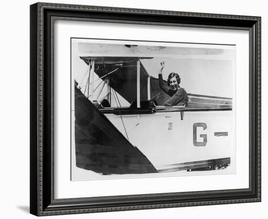 Amy Johnson (Mrs Mollison) Sits in Her Plane and Smiles and Waves to the Camera-null-Framed Art Print