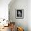 An Adorable Fluffy Kitten Looks up at Its Owner-null-Framed Photographic Print displayed on a wall