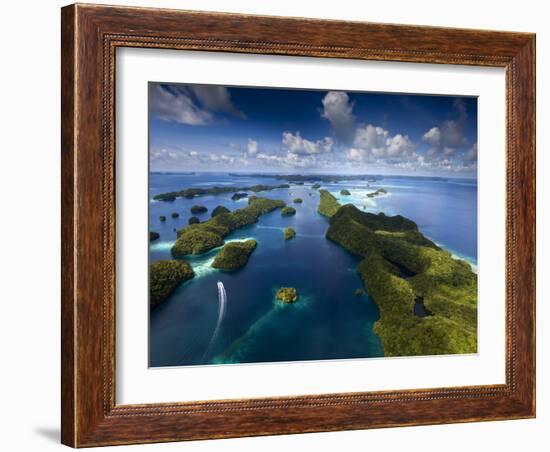 An Aerial View of a Boat as it Speeds Through the Rock Islands, Republic of Palau.-Ian Shive-Framed Photographic Print