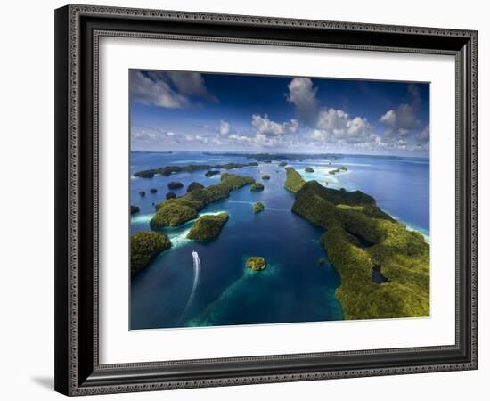 An Aerial View of a Boat as it Speeds Through the Rock Islands, Republic of Palau.-Ian Shive-Framed Photographic Print