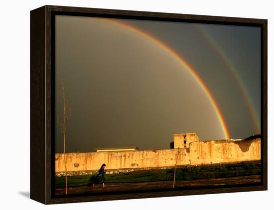 An Afghan Girl Walks Past Destroyed Buildings Occupied by Refugees-null-Framed Premier Image Canvas