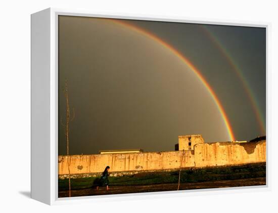 An Afghan Girl Walks Past Destroyed Buildings Occupied by Refugees-null-Framed Premier Image Canvas