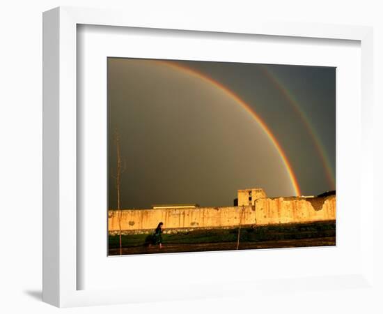 An Afghan Girl Walks Past Destroyed Buildings Occupied by Refugees-null-Framed Photographic Print