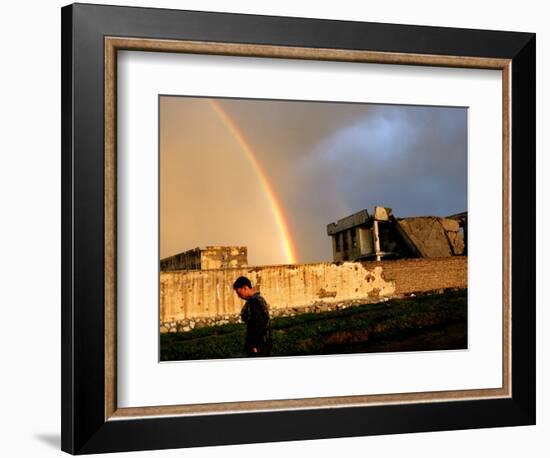 An Afghan Man Walks Past Destroyed Buildings Occupied by Refugees after a Heavy Rain-null-Framed Photographic Print