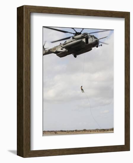 An Air Force Pararescueman Conducts a Combat Insertion and Extraction Exercise in Djibouti, Africa-null-Framed Photographic Print