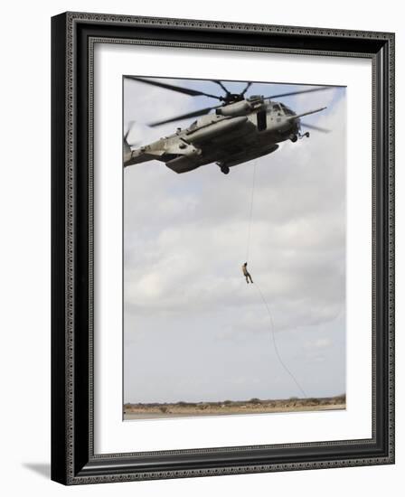 An Air Force Pararescueman Conducts a Combat Insertion and Extraction Exercise in Djibouti, Africa-null-Framed Photographic Print