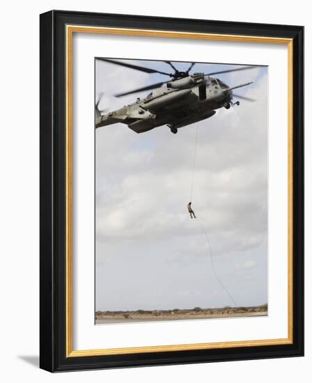 An Air Force Pararescueman Conducts a Combat Insertion and Extraction Exercise in Djibouti, Africa-null-Framed Photographic Print