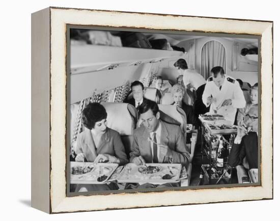 An Airline Steward and Air Hostess Serve a Roast Meal to Flight Passengers-null-Framed Premier Image Canvas