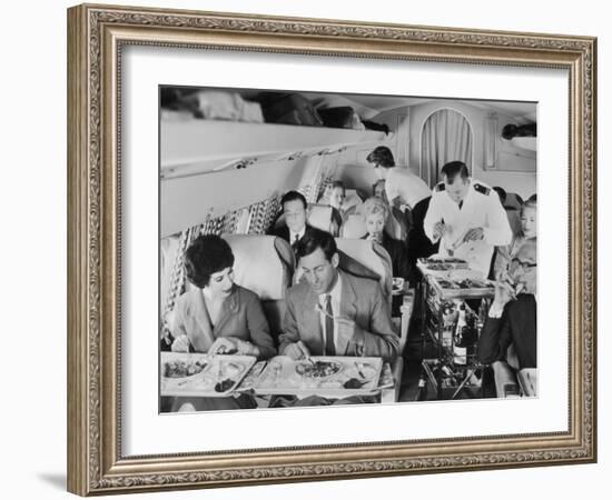 An Airline Steward and Air Hostess Serve a Roast Meal to Flight Passengers-null-Framed Photographic Print