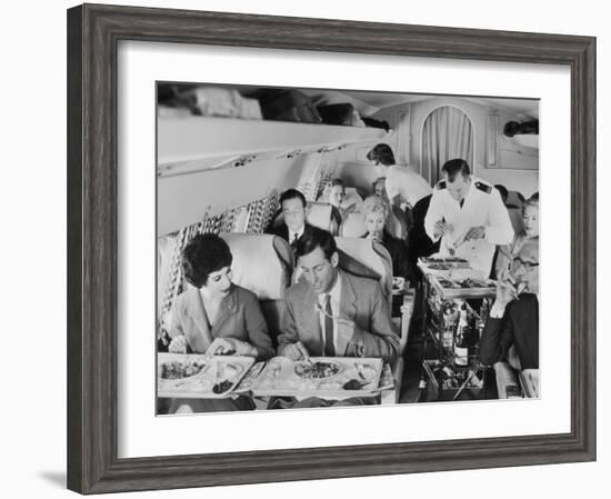 An Airline Steward and Air Hostess Serve a Roast Meal to Flight Passengers--Framed Photographic Print