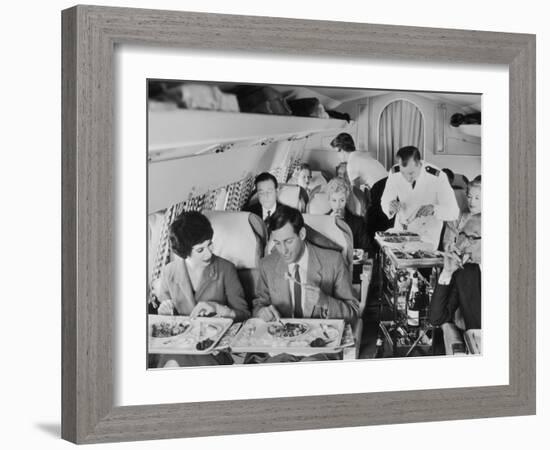 An Airline Steward and Air Hostess Serve a Roast Meal to Flight Passengers-null-Framed Photographic Print