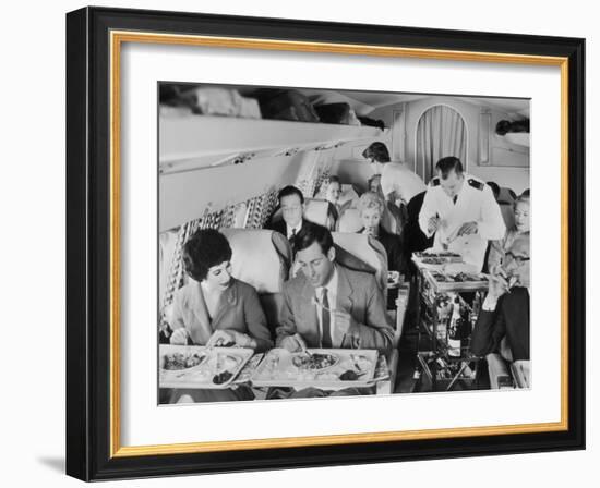 An Airline Steward and Air Hostess Serve a Roast Meal to Flight Passengers-null-Framed Photographic Print