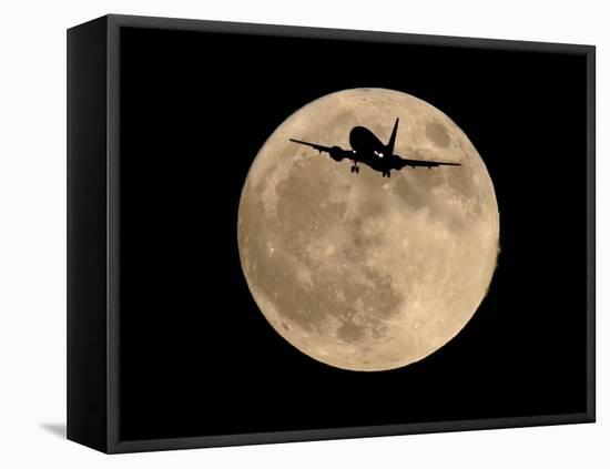 An Airliner is Silhouetted against a Full Moon-null-Framed Premier Image Canvas