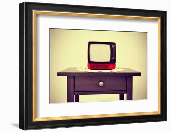 An Ancient Red Television on a Table with a Retro Effect-nito-Framed Photographic Print