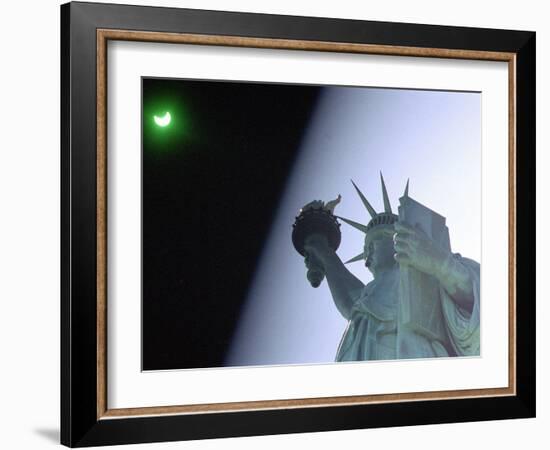 An Annular Eclipse Passes Above the Statue of Liberty-null-Framed Photographic Print