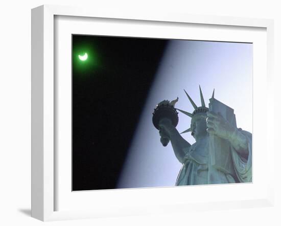 An Annular Eclipse Passes Above the Statue of Liberty-null-Framed Photographic Print