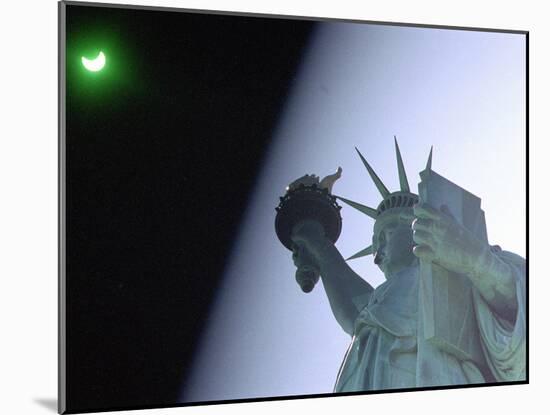 An Annular Eclipse Passes Above the Statue of Liberty-null-Mounted Photographic Print