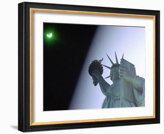 An Annular Eclipse Passes Above the Statue of Liberty-null-Framed Photographic Print