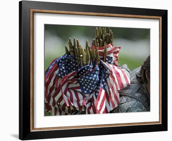 An Army Soldier's Backpack Overflows with Small American Flags-Stocktrek Images-Framed Photographic Print