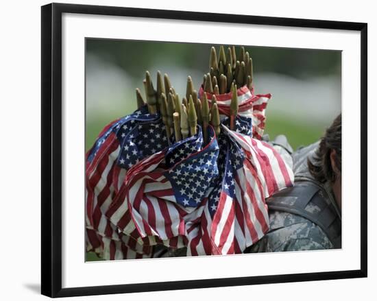 An Army Soldier's Backpack Overflows with Small American Flags-Stocktrek Images-Framed Photographic Print