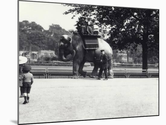 An Asian Elephant Being Ridden by Two Ladies and a Young Girl-Frederick William Bond-Mounted Photographic Print