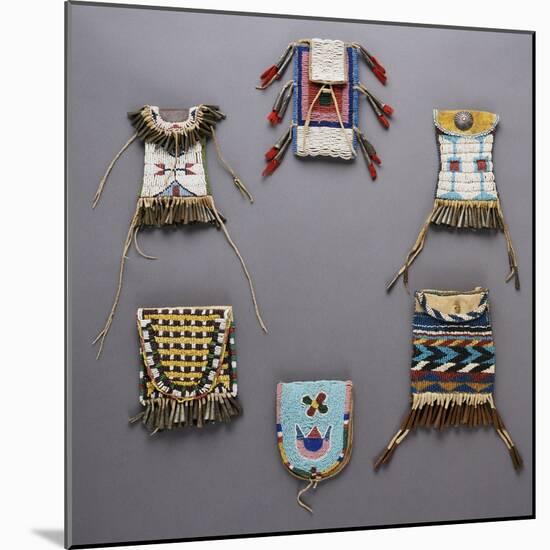 An Assortment of Kiowa, Sioux, Cheyenne, Crow, and Apache Beaded Hide Belt Pouches-null-Mounted Giclee Print