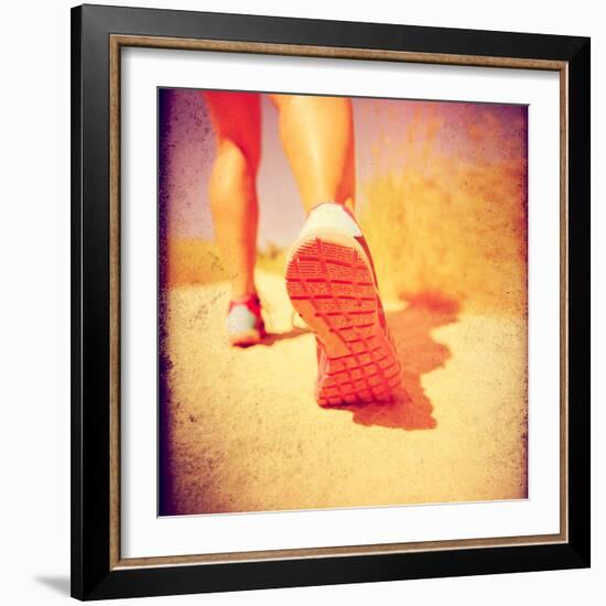 An Athletic Pair of Legs Running or Jogging on a Path during Summer Toned with a Soft Vintage Insta-graphicphoto-Framed Photographic Print