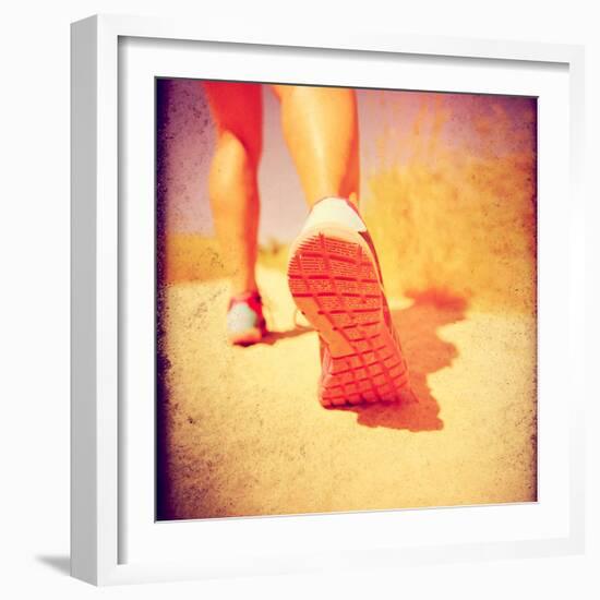 An Athletic Pair of Legs Running or Jogging on a Path during Summer Toned with a Soft Vintage Insta-graphicphoto-Framed Photographic Print