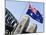 An Australian Flag Flutters in Breeze in Front of Iconic Sydney Harbour Bridge, Sydney-Andrew Watson-Mounted Photographic Print