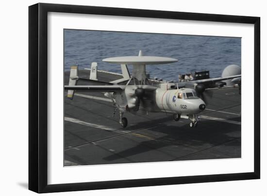 An E-2C Hawkeye Lands Aboard the Aircraft Carrier USS Nimitz-null-Framed Photographic Print