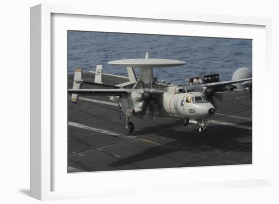 An E-2C Hawkeye Lands Aboard the Aircraft Carrier USS Nimitz-null-Framed Photographic Print