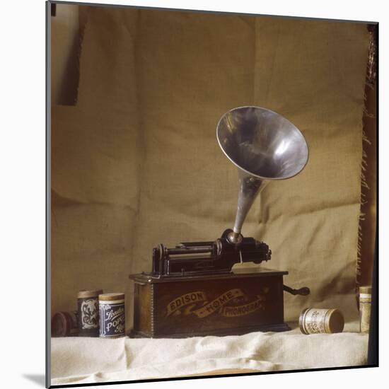 An Early Edison Phonograph Using Grooved Wax Cylinders Shown Beside the Instrument-null-Mounted Photographic Print