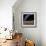 An Earth-Like Planet in Deep Space with an Orbiting Moon-null-Framed Art Print displayed on a wall