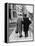 An Elderly Couple Walking Down the Street, Arm in Arm-Henry Grant-Framed Premier Image Canvas