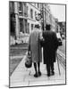 An Elderly Couple Walking Down the Street, Arm in Arm-Henry Grant-Mounted Photographic Print