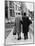 An Elderly Couple Walking Down the Street, Arm in Arm-Henry Grant-Mounted Photographic Print