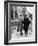 An Elderly Couple Walking Down the Street, Arm in Arm-Henry Grant-Framed Photographic Print