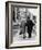 An Elderly Couple Walking Down the Street, Arm in Arm-Henry Grant-Framed Photographic Print