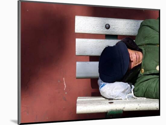 An Elderly Man Sleeps on a Bench Near Beijing's Tiananmen Square-null-Mounted Photographic Print