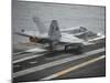 An F-A-18C Hornet Launches from the Aircraft Carrier USS Nimitz-null-Mounted Photographic Print