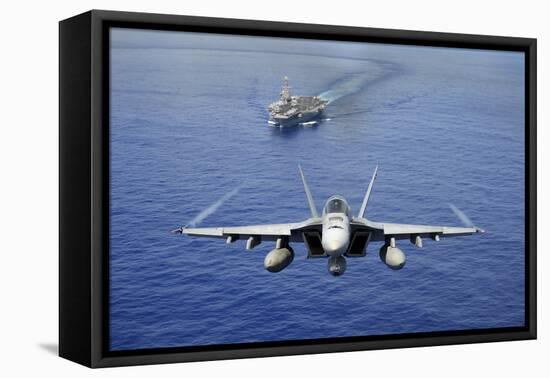 An F-A-18E Super Hornet Flying Above USS John C. Stennis-null-Framed Premier Image Canvas