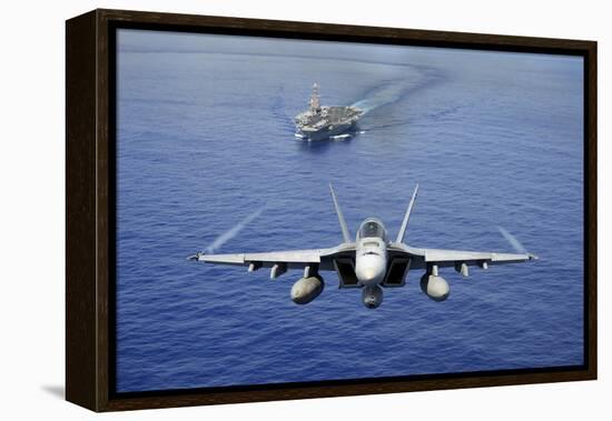 An F-A-18E Super Hornet Flying Above USS John C. Stennis-null-Framed Premier Image Canvas