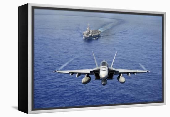 An F-A-18E Super Hornet Flying Above USS John C. Stennis-null-Framed Premier Image Canvas