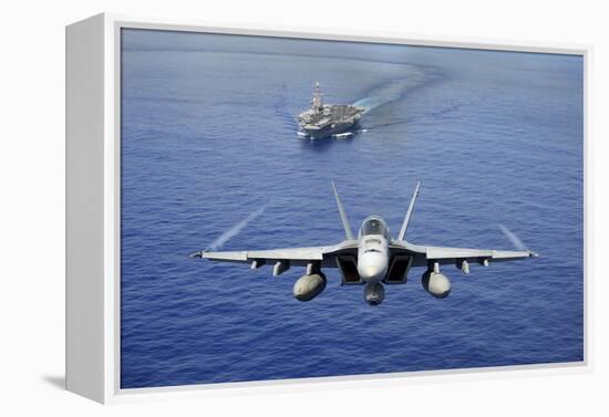 An F-A-18E Super Hornet Flying Above USS John C. Stennis-null-Framed Premier Image Canvas