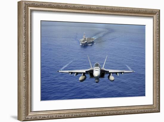 An F-A-18E Super Hornet Flying Above USS John C. Stennis-null-Framed Photographic Print