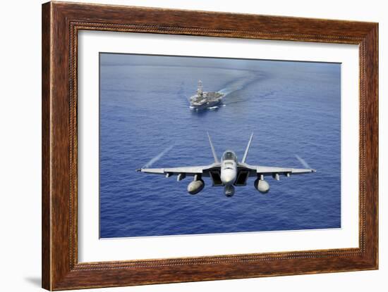 An F-A-18E Super Hornet Flying Above USS John C. Stennis-null-Framed Photographic Print
