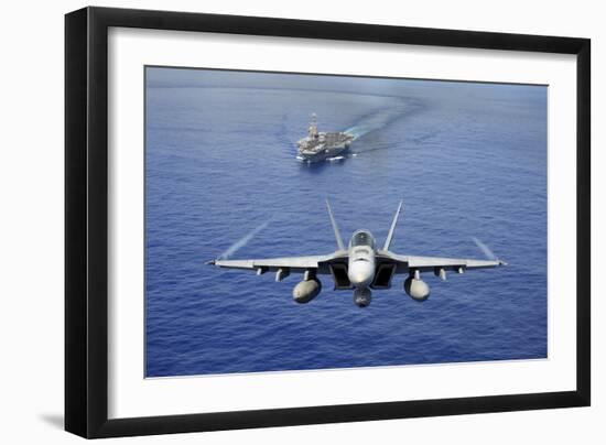 An F-A-18E Super Hornet Flying Above USS John C. Stennis--Framed Photographic Print